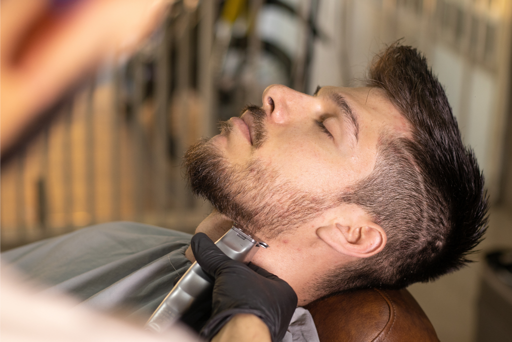 Man getting his beard trimmed